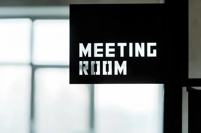An image of a black and white Meeting Room wayfinding sign.
